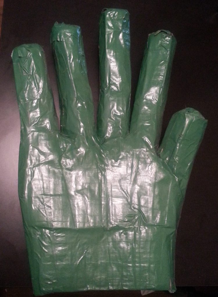 Originally made in January 2008, this hand was inspired from a picture in the They Might Be Giants Dial-a-Song album booklet. Both of the Johns were sitting in a room with giant hands, presumably made from duct tape. I wanted my own so I tried my hand and replicating them. 